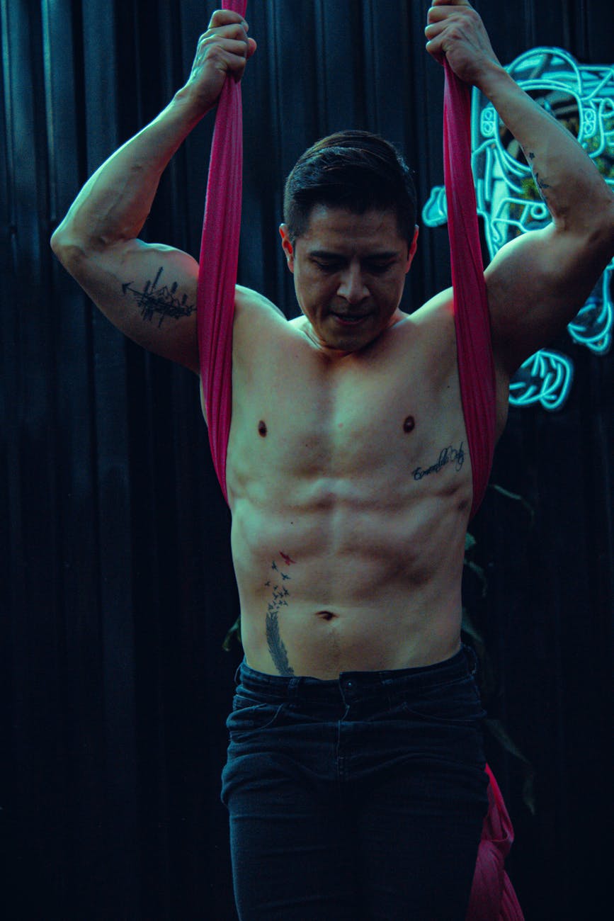 Man performing a strength exercise in a calm, focused environment.