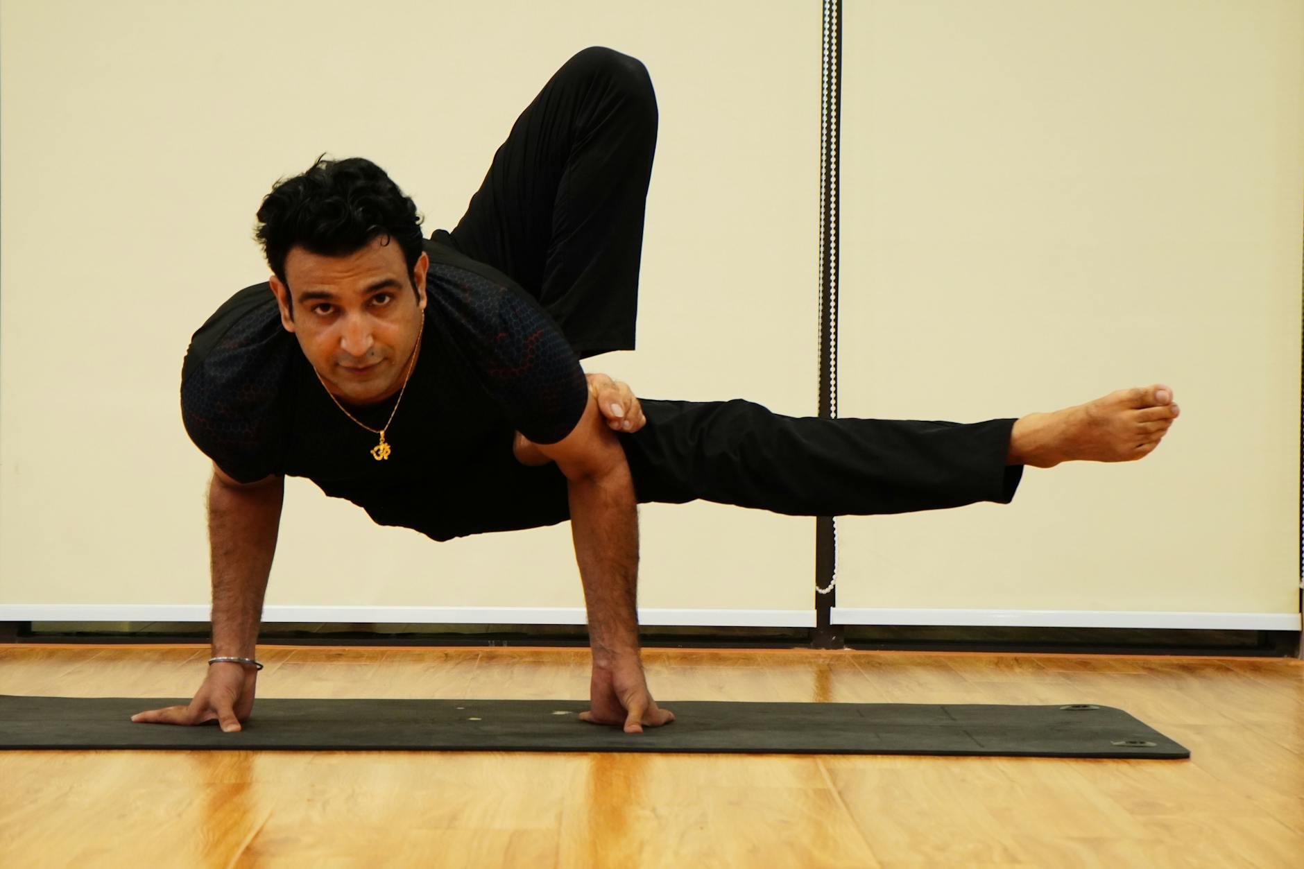 Man stretching, demonstrating improved flexibility and body control.